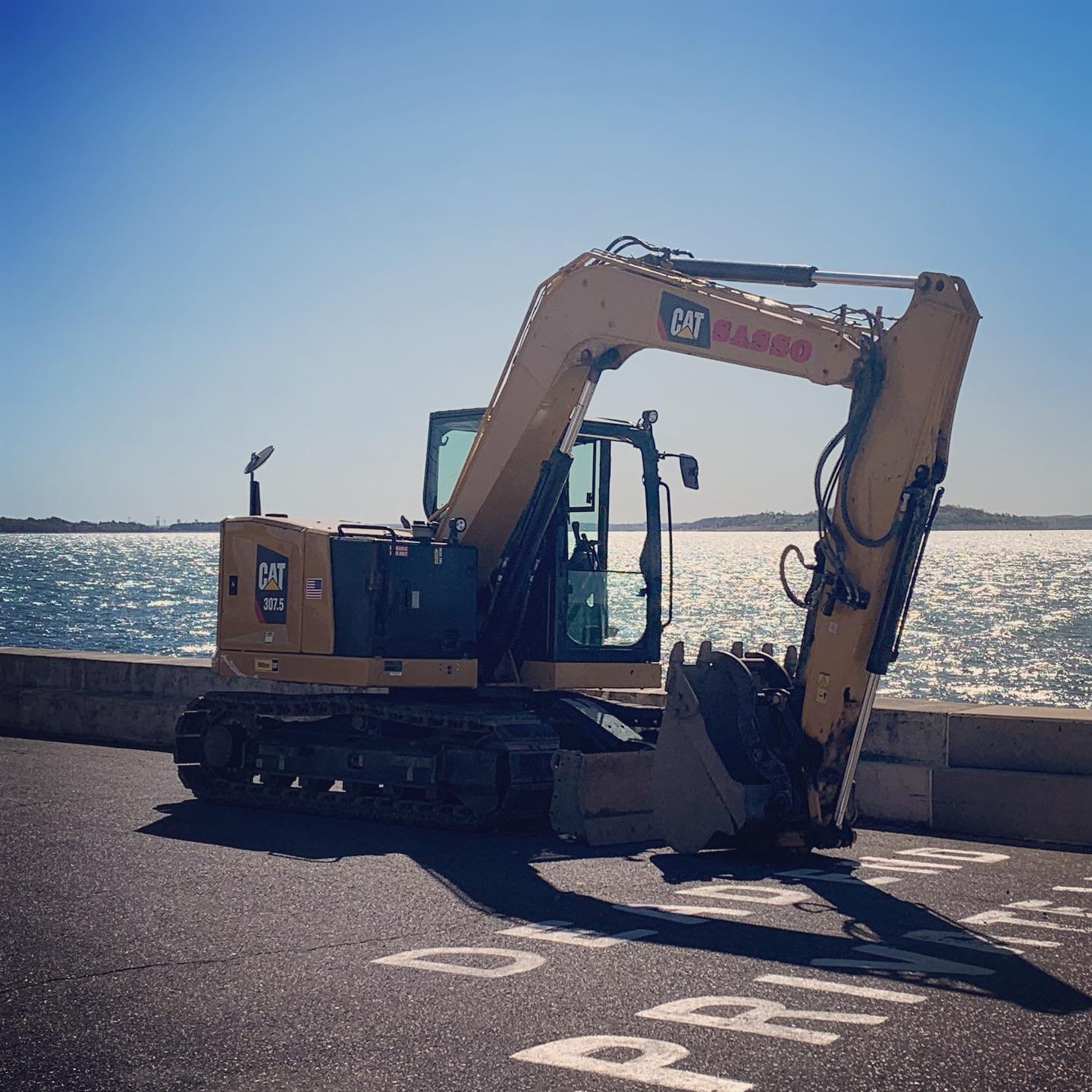 Sasso excavator near the waterfront