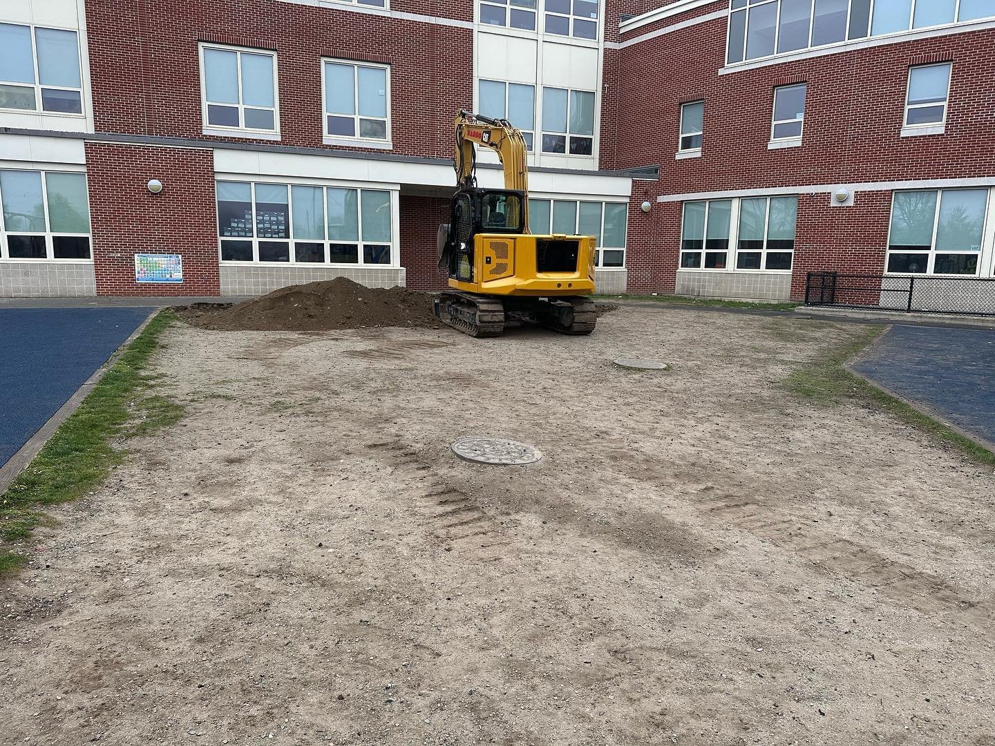 Heavy equipment clearing and preparing a site