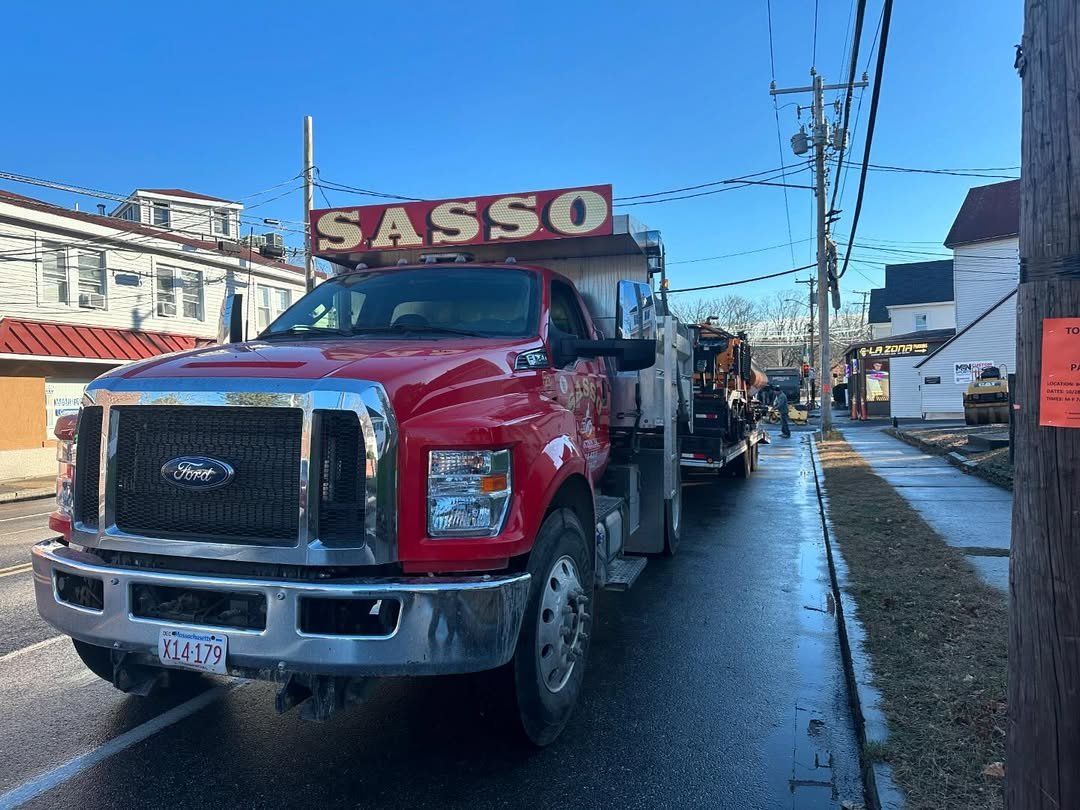 Sasso truck and paving crew on site