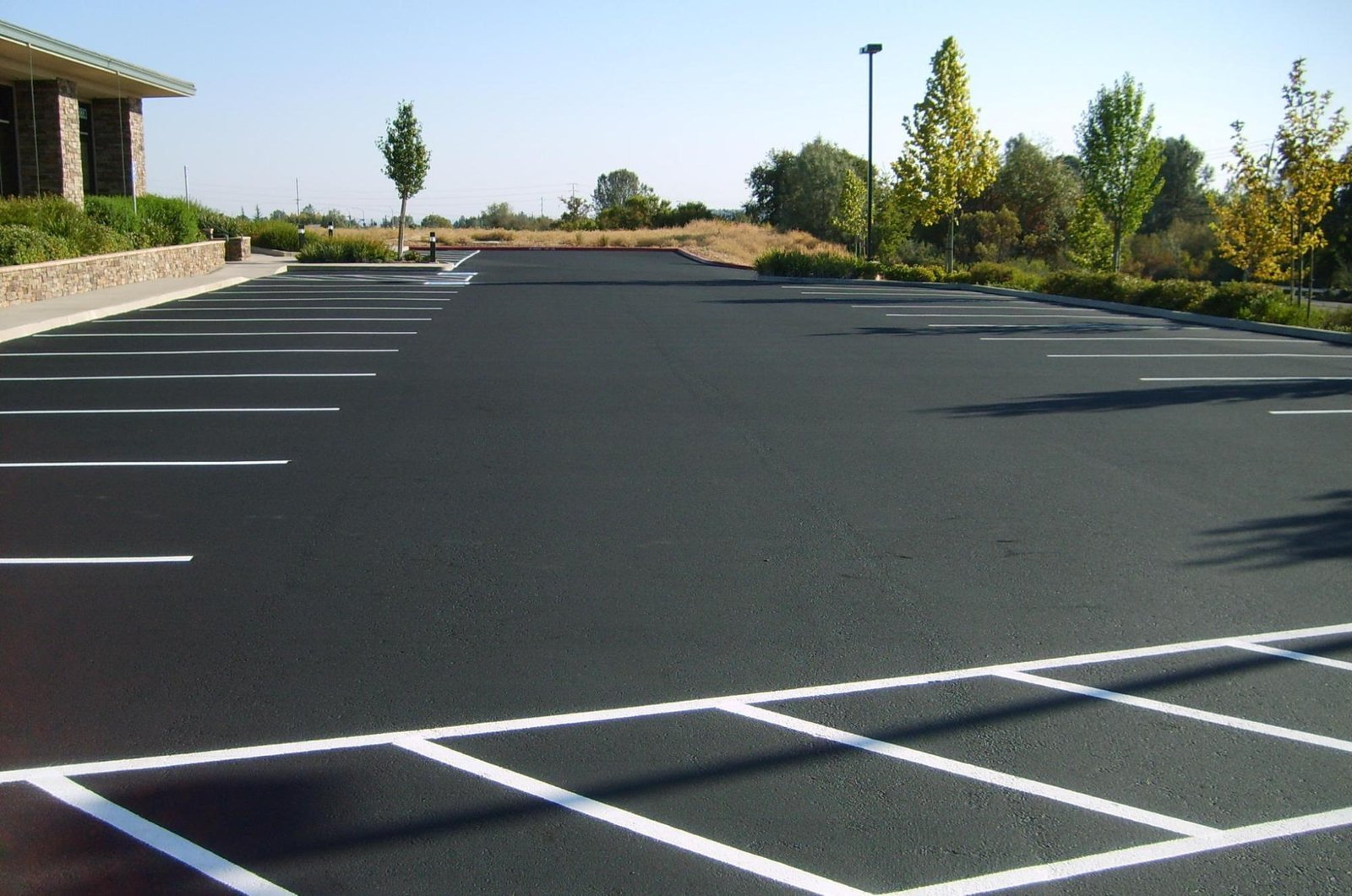 Fresh asphalt parking lot paving